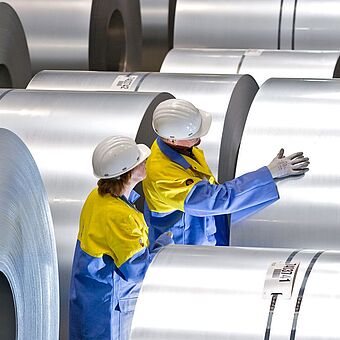 Quality inspection of a steel coil by Tata Steel Nederland employees during the production process.