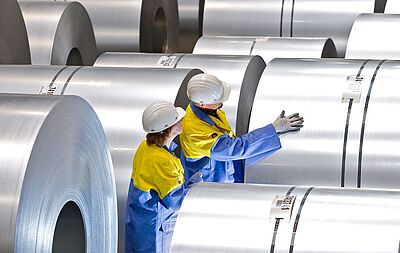 Quality inspection of a steel coil by Tata Steel Nederland employees during the production process.